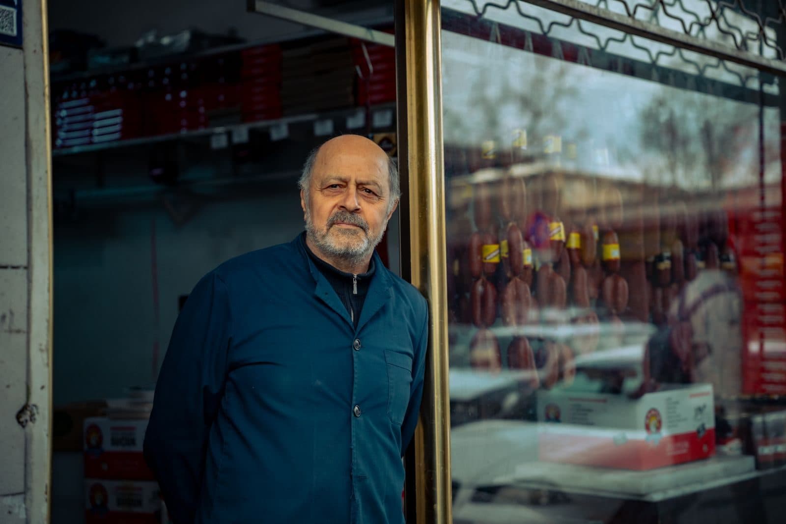 Shop owner standing in the doorway of his storefront